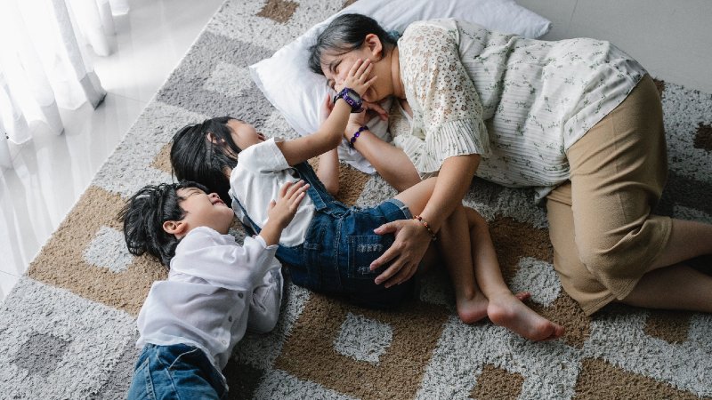 Kids playing with babysitter